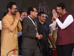 Devendra Fadnavis, former deputy CM of Maharashtra, with actor Amir Khan at the State of Bharatiya Jain Sanghat Samamel. Devendra Fadnavis, former deputy CM of Maharashtra, with actor Amir Khan at the State of Bharatiya Jain Sanghat Samamel.
