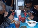 Migrants deported from the US celebrate the traditional Thanksgiving with a meal offered by deported migrant Esther Morales at her restaurant.