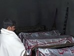 A mourner stands beside the dead bodies of victims who were killed in sectarian attacks in Kurram district at a Shitte Muslim mosque in Parachinar, the mountainous Khyber Pakhtunkhwa province, on November 22, 2024. A mourner stands beside the dead bodies of victims who were killed in sectarian attacks in Kurram district at a Shitte Muslim mosque in Parachinar, the mountainous Khyber Pakhtunkhwa province, on November 22, 2024.