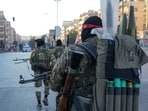 Anti-government fighters patrol in central Aleppo on November 30, 2024.