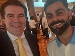 Australian minister Tim Watts with Virat Kohli.