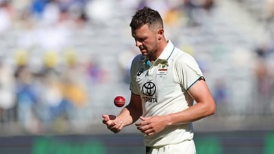 Australia's Josh Hazlewood tosses the ball as he prepares to bowl on the second day of the first Test (AP) Australia's Josh Hazlewood tosses the ball as he prepares to bowl on the second day of the first Test (AP)