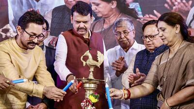 BJP leader Devendra Fadnavis along with Actor Aamir Khan and others light a ceremonial lamp during the Bharatiya Jain Sanghatana National Convention 2024, in Pune on Saturday. (Devendra Fadnavis X) BJP leader Devendra Fadnavis along with Actor Aamir Khan and others light a ceremonial lamp during the Bharatiya Jain Sanghatana National Convention 2024, in Pune on Saturday. (Devendra Fadnavis X)