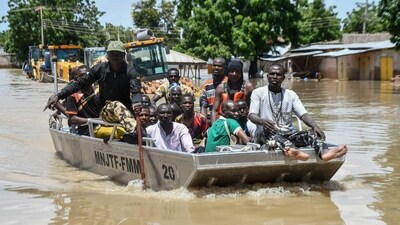 (Representative image) People affected by floods are escorted through flood water on a military boat in Nigeria's Maiduguri. (AFP) (Representative image) People affected by floods are escorted through flood water on a military boat in Nigeria's Maiduguri. (AFP)