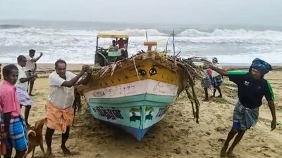 Fishermen move a boat to a safer place as a deep depression over the Bay of Bengal is expected to intensify into cyclone 'Fengal', in Tiruchirappalli, Tamil Nadu. (PTI) Fishermen move a boat to a safer place as a deep depression over the Bay of Bengal is expected to intensify into cyclone 'Fengal', in Tiruchirappalli, Tamil Nadu. (PTI)
