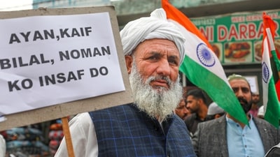 A man protests against the violence in Uttar Pradesh's Sambhal area, in Jammu on Saturday, (PTI) A man protests against the violence in Uttar Pradesh's Sambhal area, in Jammu on Saturday, (PTI)