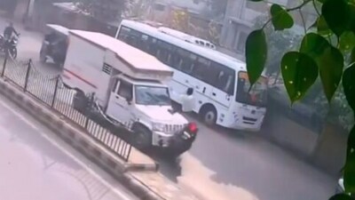 A scooter rider narrowly escaped disaster, landing on a truck's bonnet after losing control. (X) A scooter rider narrowly escaped disaster, landing on a truck's bonnet after losing control. (X)
