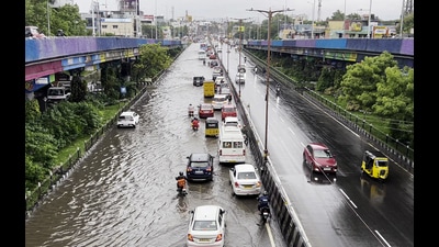 Vehicles ply on a waterlogged road following heavy rainfall triggered by Cyclone Fengal, in Chennai on Saturday. (ANI) Vehicles ply on a waterlogged road following heavy rainfall triggered by Cyclone Fengal, in Chennai on Saturday. (ANI)