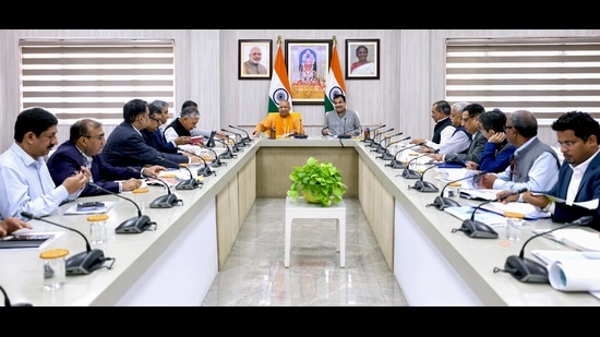 Chief Minister Yogi Adityanath, Union Minister for Road Transport and Highways Nitin Gadkari and others during a review meeting at the former’s official residence, in Lucknow on Saturday. (HT PHOTO)