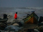 A visitor takes pictures as sea waves crash amid strong winds at the Marina beach, in Chennai, Saturday, Nov. 30, 2024. A visitor takes pictures as sea waves crash amid strong winds at the Marina beach, in Chennai, Saturday, Nov. 30, 2024.