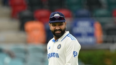 India's Rohit Sharma walks back after winning the toss and decided to field first before the start of tour match between the Prime Minister's XI and India at Manuka Oval (AFP) India's Rohit Sharma walks back after winning the toss and decided to field first before the start of tour match between the Prime Minister's XI and India at Manuka Oval (AFP)