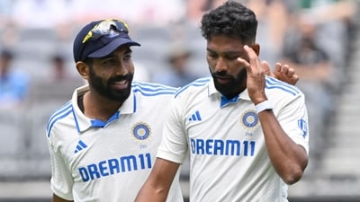 India's skipper Jasprit Bumrah (L) talks with paceman Mohammed Siraj. (Photo by SAEED KHAN / AFP) (AFP) India's skipper Jasprit Bumrah (L) talks with paceman Mohammed Siraj. (Photo by SAEED KHAN / AFP) (AFP)