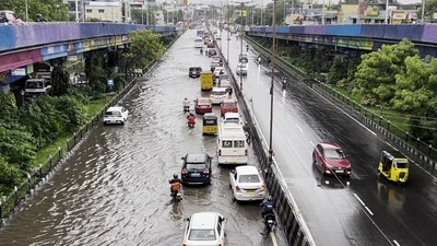 Vehicles ply on a waterlogged road following heavy rainfall triggered by Cyclone Fengal, in Chennai. (ANI) Vehicles ply on a waterlogged road following heavy rainfall triggered by Cyclone Fengal, in Chennai. (ANI)