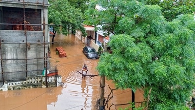 People wade through a flooded street in the aftermath of Cyclone Fengal, in Puducherry on Sunday, Dec. 1. (PTI) People wade through a flooded street in the aftermath of Cyclone Fengal, in Puducherry on Sunday, Dec. 1. (PTI)