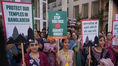 Devotees and followers of the Hare Krishna temple participate in a Global Kirtan Protest for Justice and Protection in solidarity with ISKCON members. (AP Photo) (AP) Devotees and followers of the Hare Krishna temple participate in a Global Kirtan Protest for Justice and Protection in solidarity with ISKCON members. (AP Photo) (AP)