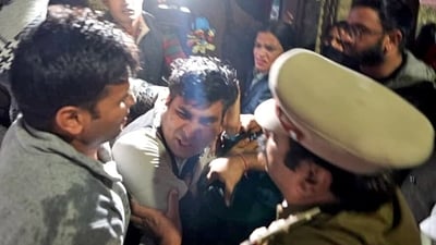 Delhi Police detain the person who tried to throw a liquid on former Delhi CM and Aam Aadmi Party (AAP) national convener Arvind Kejriwal during his padyatra at Greater Kailash in New Delhi on Saturday. Delhi Police detain the person who tried to throw a liquid on former Delhi CM and Aam Aadmi Party (AAP) national convener Arvind Kejriwal during his padyatra at Greater Kailash in New Delhi on Saturday.