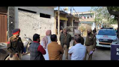 Police officials at the crime spot in Dhandhari Khurd on Sunday morning. (HT photo) Police officials at the crime spot in Dhandhari Khurd on Sunday morning. (HT photo)