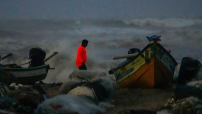 A visitor takes pictures as sea waves crash amid strong winds at the Marina beach, in Chennai, Saturday, Nov. 30, 2024. (PTI) A visitor takes pictures as sea waves crash amid strong winds at the Marina beach, in Chennai, Saturday, Nov. 30, 2024. (PTI)