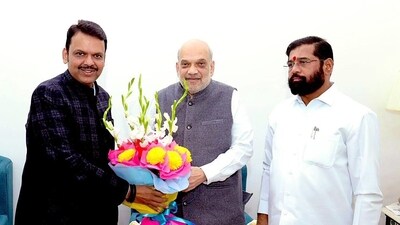 Maharashtra's caretaker CM and Shiv Sena chief Eknath Shinde and BJP leader Devendra Fadnavis meet Union Home Minister Amit Shah, in New Delhi on Thursday. (Maharashtra CMO) Maharashtra's caretaker CM and Shiv Sena chief Eknath Shinde and BJP leader Devendra Fadnavis meet Union Home Minister Amit Shah, in New Delhi on Thursday. (Maharashtra CMO)
