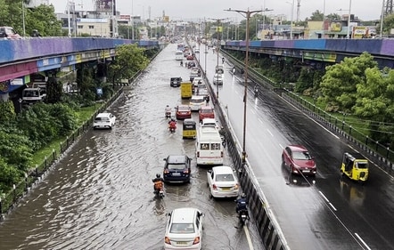 Vehicles ply on a waterlogged road following heavy rainfall triggered by Cyclone Fengal, in Chennai on Saturday. (ANI) (HT_PRINT) Vehicles ply on a waterlogged road following heavy rainfall triggered by Cyclone Fengal, in Chennai on Saturday. (ANI) (HT_PRINT)