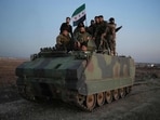 Anti-government fighters reach the highway near the northern Syrian town of Azaz on December 1, 2024. The United States and its allies France, Germany and Britain called Sunday for "de-escalation" in Syria and urged in a joint statement for the protection of civilians and infrastructure. 