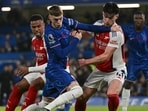 Chelsea's English midfielder Cole Palmer vies with Arsenal's English midfielder Declan Rice. (Photo by Glyn KIRK / AFP) 