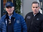 A November 29, 2024 photo shows US President Joe Biden and son Hunter Biden stepping out of a bookstore while shopping in Nantucket, Massachusetts on November 29, 2024. Biden on Sunday issued an official pardon for his son Hunter, who is facing sentencing for two criminal cases related to tax evasion and the purchase of a firearm. (Photo by Mandel NGAN / AFP)