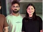 Virat Kohli and Anushka Sharma pose with a fan in Australia. Virat Kohli and Anushka Sharma pose with a fan in Australia.