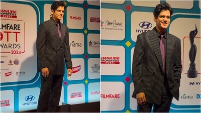 Vijay Varma slayed in a black and white striped pantsuit, paired with a black shirt and a pink printed tie. His gelled hair and clean-shaven look added an extra touch of dapper charm. Vijay Varma slayed in a black and white striped pantsuit, paired with a black shirt and a pink printed tie. His gelled hair and clean-shaven look added an extra touch of dapper charm.