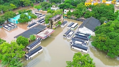 Buses seen parked at a flooded bus depot amid heavy rainfall triggered by Cyclone Fengal, in Puducherry on Sunday. (ANI Photo) (ANI) Buses seen parked at a flooded bus depot amid heavy rainfall triggered by Cyclone Fengal, in Puducherry on Sunday. (ANI Photo) (ANI)