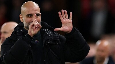 Pep Guardiola held up six fingers in retaliation to "sacked in the morning" chants from Liverpool fans (AFP) Pep Guardiola held up six fingers in retaliation to "sacked in the morning" chants from Liverpool fans (AFP)