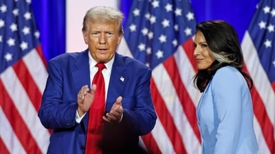 Former US President and Republican presidential candidate Donald Trump (left) claps as he leaves the stage after speaking alongside former US Representative Tulsi Gabbard during a town hall meeting in La Crosse, Wisconsin, on August 29. (AFP) Former US President and Republican presidential candidate Donald Trump (left) claps as he leaves the stage after speaking alongside former US Representative Tulsi Gabbard during a town hall meeting in La Crosse, Wisconsin, on August 29. (AFP)