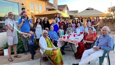 JD Vance is pictured standing on the right corner with his son seated on his shoulders while his wife Usha Vance is on the left. (X/@ashajadeja325) JD Vance is pictured standing on the right corner with his son seated on his shoulders while his wife Usha Vance is on the left. (X/@ashajadeja325)