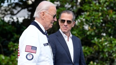 FILE - President Joe Biden, wearing a Team USA jacket and walking with his son Hunter Biden, heads toward Marine One on the South Lawn of the White House in Washington, July 26, 2024. (AP Photo/Susan Walsh, File) (AP) FILE - President Joe Biden, wearing a Team USA jacket and walking with his son Hunter Biden, heads toward Marine One on the South Lawn of the White House in Washington, July 26, 2024. (AP Photo/Susan Walsh, File) (AP)