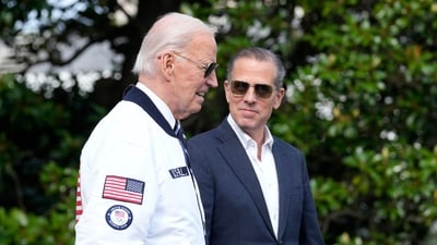 President Joe Biden, wearing a Team USA jacket and walking with his son Hunter Biden, heads toward Marine One on the South Lawn of the White House in Washington, July 26, 2024. (AP) President Joe Biden, wearing a Team USA jacket and walking with his son Hunter Biden, heads toward Marine One on the South Lawn of the White House in Washington, July 26, 2024. (AP)