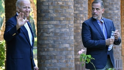 US President Joe Biden waves alongside his son Hunter Biden after attending mass at Holy Spirit Catholic Church in Johns Island. (AFP) US President Joe Biden waves alongside his son Hunter Biden after attending mass at Holy Spirit Catholic Church in Johns Island. (AFP)