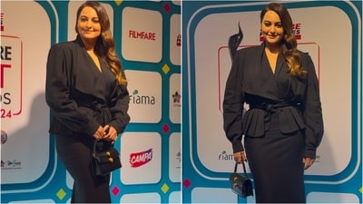 Sonakshi Sinha nailed power dressing in a black top with bold power shoulders and tie-on detailing. She paired it with a matching pencil skirt, exuding confidence and style. Sonakshi Sinha nailed power dressing in a black top with bold power shoulders and tie-on detailing. She paired it with a matching pencil skirt, exuding confidence and style.
