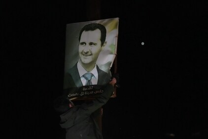 Anti-government fighters tear up a poster for Syrian President Bachar al Assad as they take over the northern Syrian town of Tal Rifaat on December 1, 2024. The United States and its allies France, Germany and Britain called Sunday for "de-escalation" in Syria and urged in a joint statement for the protection of civilians and infrastructure. (AFP/ Rami al SAYED) Anti-government fighters tear up a poster for Syrian President Bachar al Assad as they take over the northern Syrian town of Tal Rifaat on December 1, 2024. The United States and its allies France, Germany and Britain called Sunday for "de-escalation" in Syria and urged in a joint statement for the protection of civilians and infrastructure. (AFP/ Rami al SAYED)