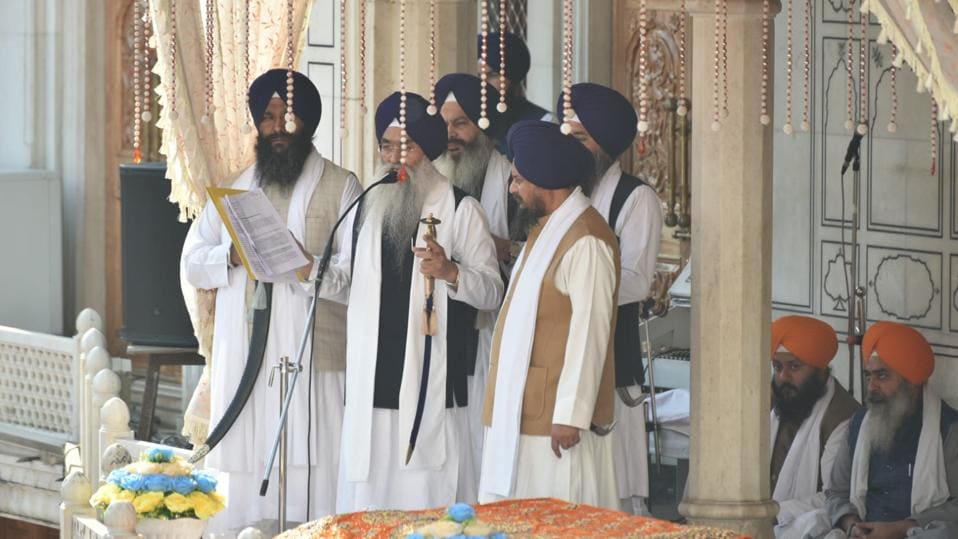 The five Sikh high priests, led by Akal Takht jathedar Giani Raghbir Singh reading out the punishment in the Golden Temple complex on Monday. (Sameer Sehgal/HT) The five Sikh high priests, led by Akal Takht jathedar Giani Raghbir Singh reading out the punishment in the Golden Temple complex on Monday. (Sameer Sehgal/HT)