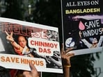 Devotees and members of the International Society for Krishna Consciousness (ISKCON) hold posters during a protest outside the Bangladesh high commission in Mumbai on December 2 amid the unrest in Bangladesh after the arrest of Hindu monk Chinmoy Krishna Das Brahmachari. 