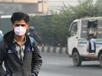 New Delhi, India : An office goer is seen wearing a mask amid the polluted weather at Anand Vihar Bus terminal in New Delhi New Delhi, India : An office goer is seen wearing a mask amid the polluted weather at Anand Vihar Bus terminal in New Delhi