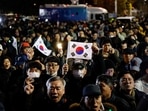 People gather outside the National Assembly, after South Korean President Yoon Suk Yeol declared martial law, in Seoul, South Korea, December 4, 2024.