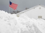 - DECEMBER 2:The flag flies over the Lawrence Athletic Club in front of a mountain of snow after a record snowfall left over 3 feet on the ground on December 2, 2024 in Erie,.