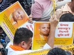 BJP leader Suvendu Adhikari holds posters of spiritual leader Chinmoy Krishna Das who was arrested in Bangladesh during a protest for Das's release and against the alleged atrocities on Hindus in the neighbouring country.