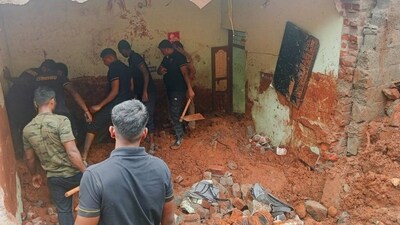 A rescue operation in progress following a landslide caused by continuous rainfall triggered by cyclone at Tiruvannamalai district in Tamil Nadu on Tuesday. (PTI) A rescue operation in progress following a landslide caused by continuous rainfall triggered by cyclone at Tiruvannamalai district in Tamil Nadu on Tuesday. (PTI)