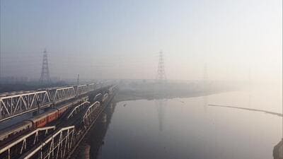 A thin layer of smog engulfs the area surrounding Old Yamuna Bridge (Loha Pul) in New Delhi. (ANI Photo) A thin layer of smog engulfs the area surrounding Old Yamuna Bridge (Loha Pul) in New Delhi. (ANI Photo)