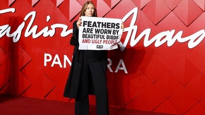 The British Fashion Awards was not devoid of drama. During the red carpet photocall, a protester from PETA barged on the red carpet at the Royal Albert Hall holding a poster that said ‘Feathers are worn by beautiful birds and ugly people’.&nbsp; (REUTERS)