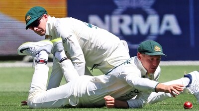 Australia's Marnus Labuschagne, right, reaches out for the ball as he and teammate Steve Smith attempt to field the ball. (AP Photo/Trevor Collens) (AP) Australia's Marnus Labuschagne, right, reaches out for the ball as he and teammate Steve Smith attempt to field the ball. (AP Photo/Trevor Collens) (AP)