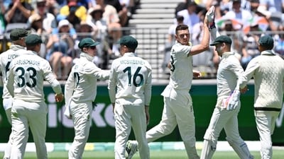 Australia's paceman Josh Hazlewood (3nd R) celebrates his wicket of India's Virat Kohli with teammates during the first day of the third first Test cricket match between Australia and India at the Optus Stadium (AFP) Australia's paceman Josh Hazlewood (3nd R) celebrates his wicket of India's Virat Kohli with teammates during the first day of the third first Test cricket match between Australia and India at the Optus Stadium (AFP)