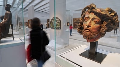 A journalist walks past the "Head of Christ crowned with thorns" (R), from the chapel of Notre Dame de l'Echerelle-Troyes, during a press visit of the renewed Time Gallery at the Louvre-Lens (AFP) A journalist walks past the "Head of Christ crowned with thorns" (R), from the chapel of Notre Dame de l'Echerelle-Troyes, during a press visit of the renewed Time Gallery at the Louvre-Lens (AFP)